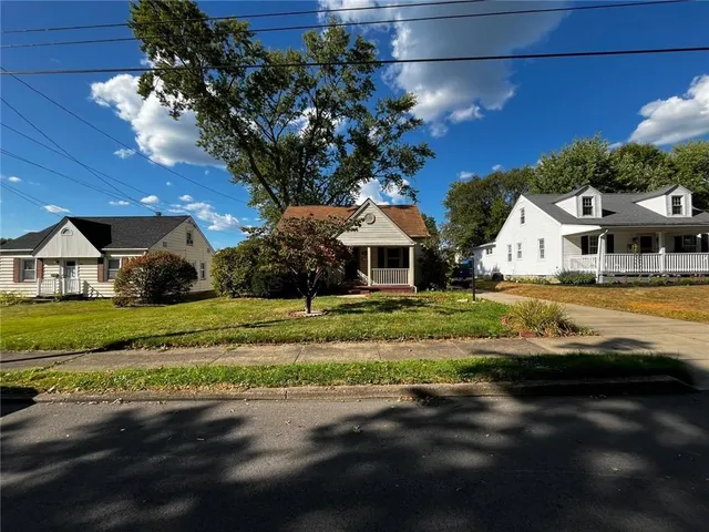 a view of house with yard