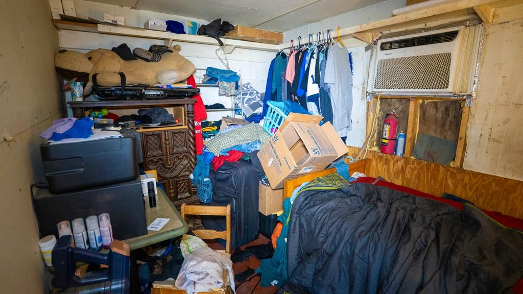7000 County Road 131B Terrell, TX 75161 - Photo 11 of 24 a view of walk in closet with clothes and shoes