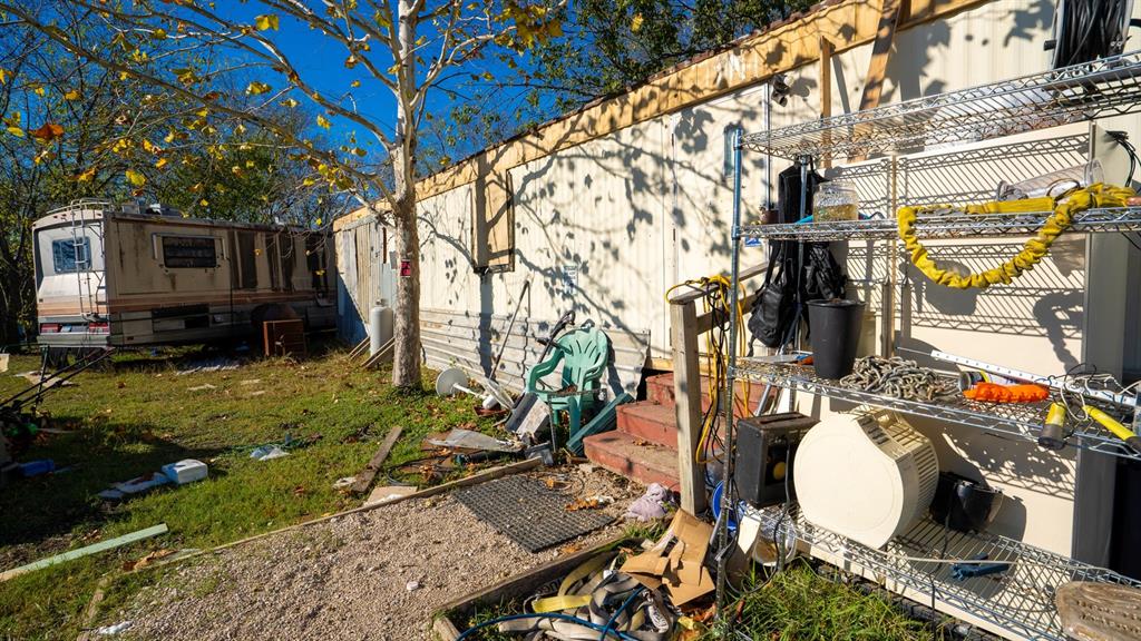 7000 County Road 131B Terrell, TX 75161 - Photo 18 of 24 a backyard of a house with barbeque oven table and chairs