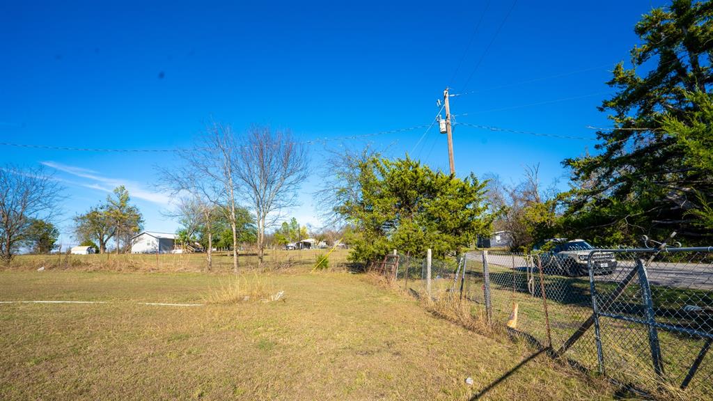 7000 County Road 131B Terrell, TX 75161 - Photo 20 of 24 a backyard of a house with table and chairs