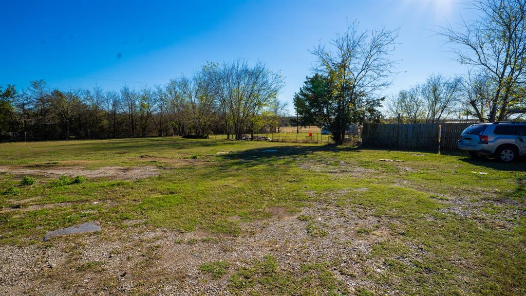 7000 County Road 131B Terrell, TX 75161 - Photo 22 of 24 a view of a big yard with trees