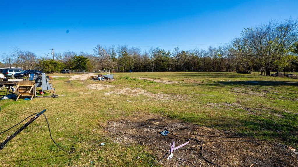 7000 County Road 131B Terrell, TX 75161 - Photo 23 of 24 a view of a swimming pool and a yard