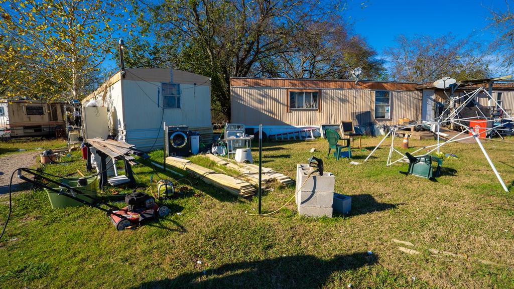7000 County Road 131B Terrell, TX 75161 - Photo 6 of 24 a view of a house with backyard water fountain and sitting area