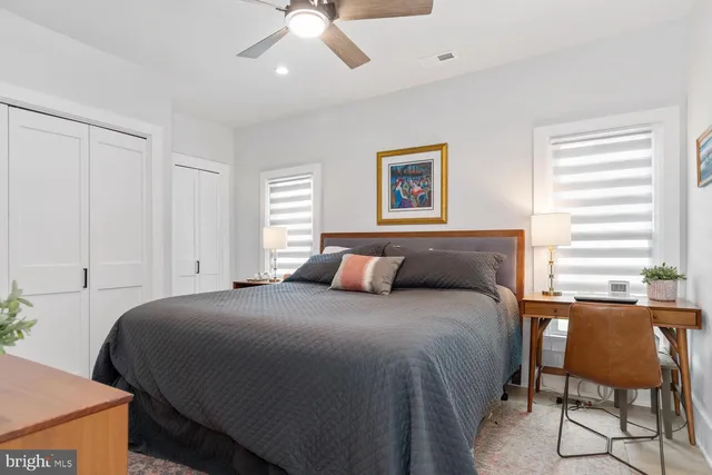 a bedroom with a bed and a chair