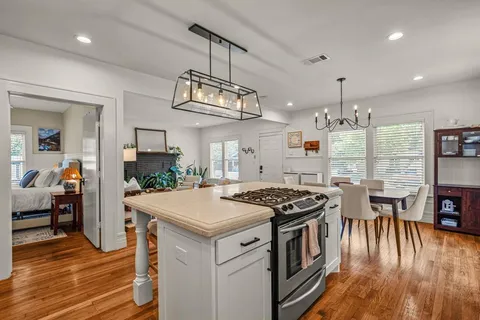 a kitchen that has a lot of cabinets in it