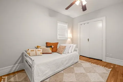 a bed room with a bed and a chandelier