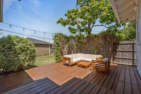 a view of a wooden deck with a bench