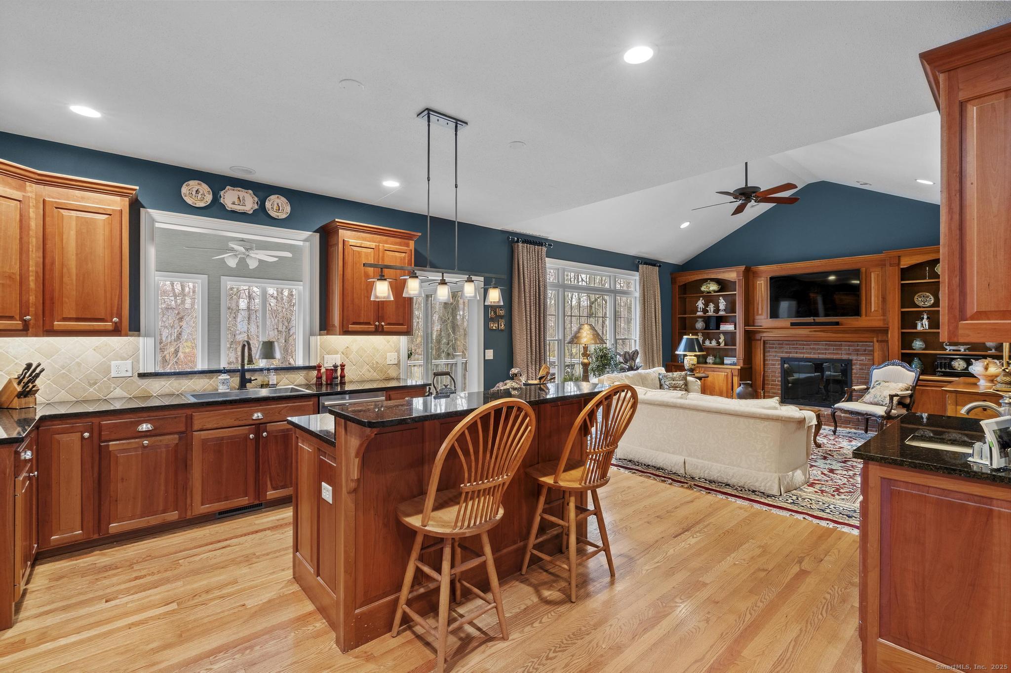 18 Daniel Circle, Unit 18 Suffield, CT 06078 - Photo 12 of 38 a large kitchen with lots of counter space dining table and stainless steel appliances