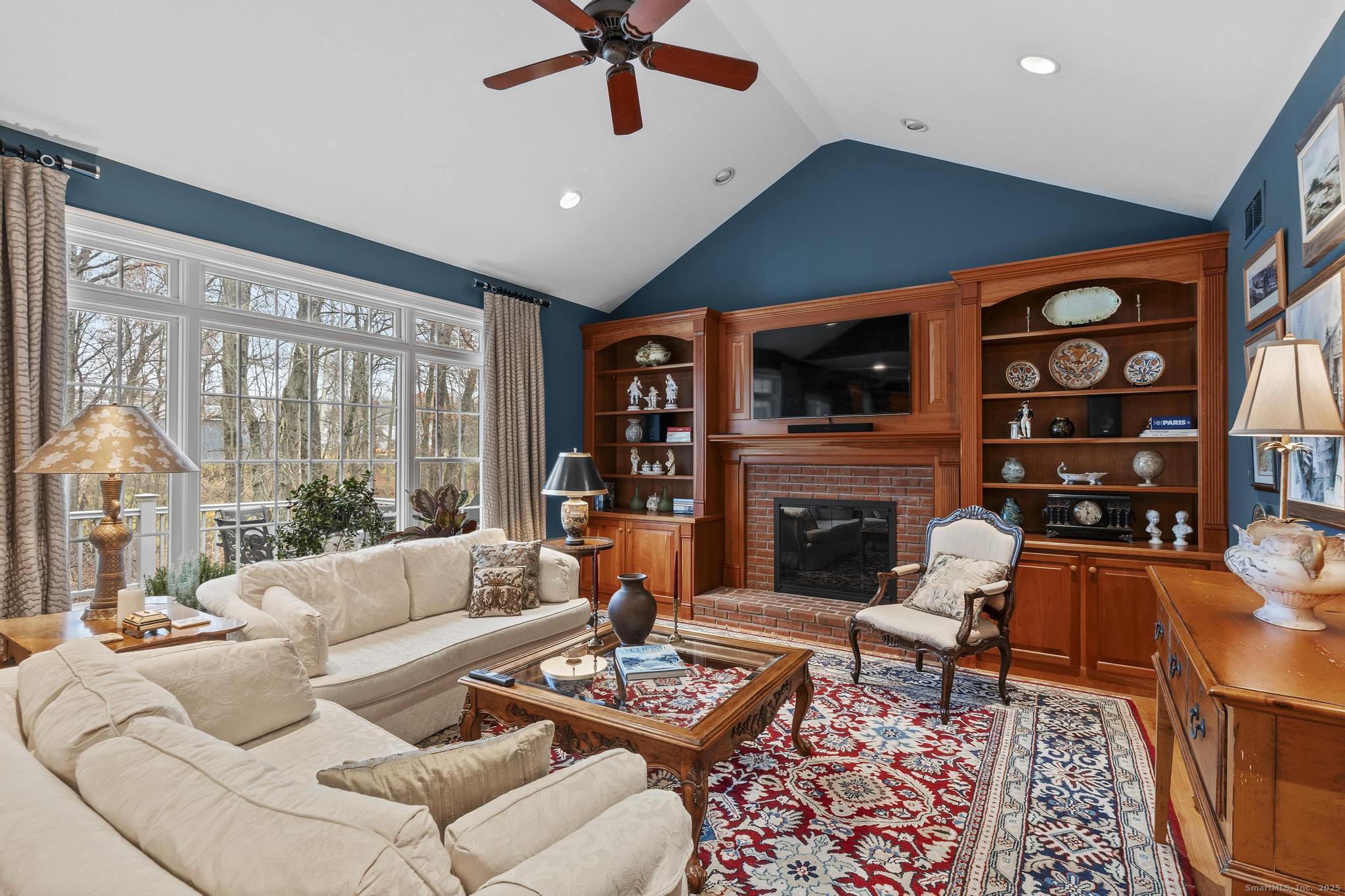 18 Daniel Circle, Unit 18 Suffield, CT 06078 - Photo 13 of 38 a living room with fireplace furniture and a flat screen tv