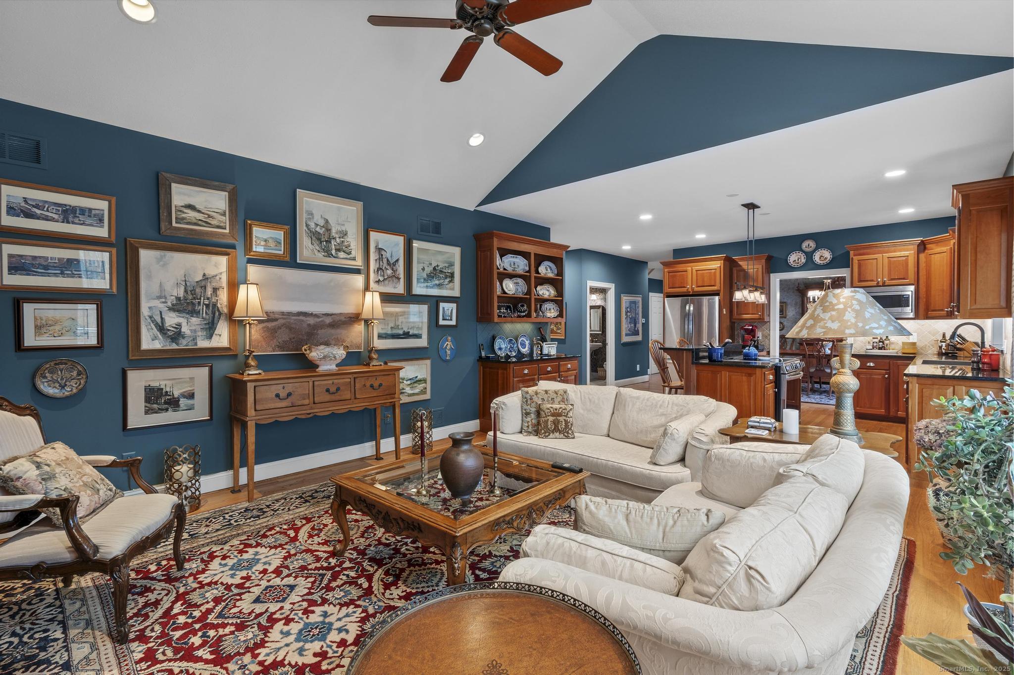 18 Daniel Circle, Unit 18 Suffield, CT 06078 - Photo 14 of 38 a living room with furniture kitchen view and a large window