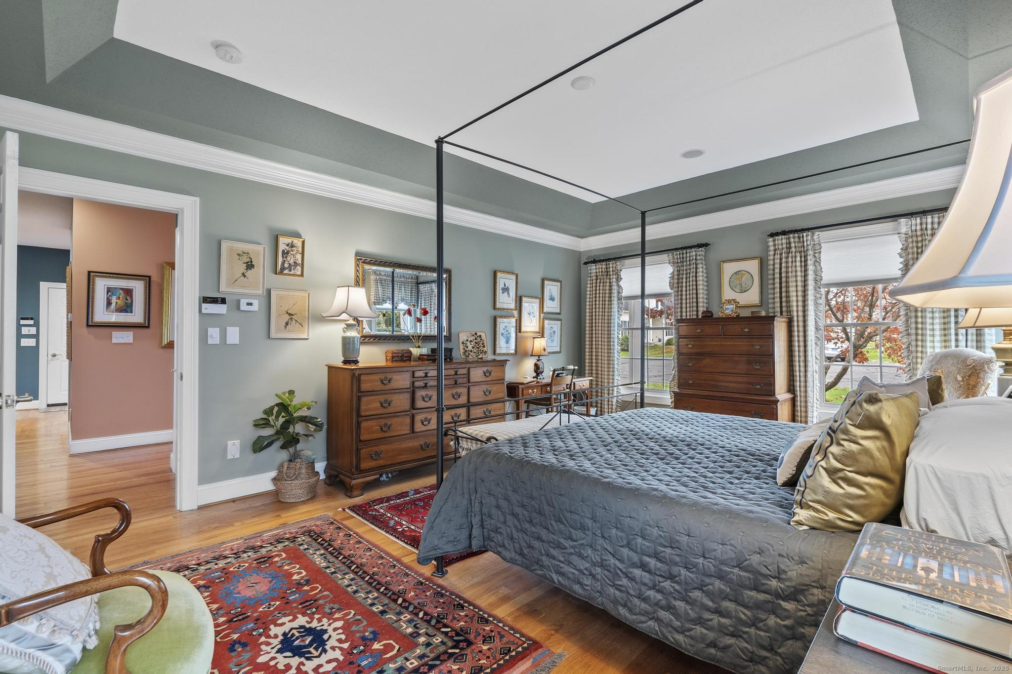 18 Daniel Circle, Unit 18 Suffield, CT 06078 - Photo 23 of 38 a bedroom with a bed and wooden floor