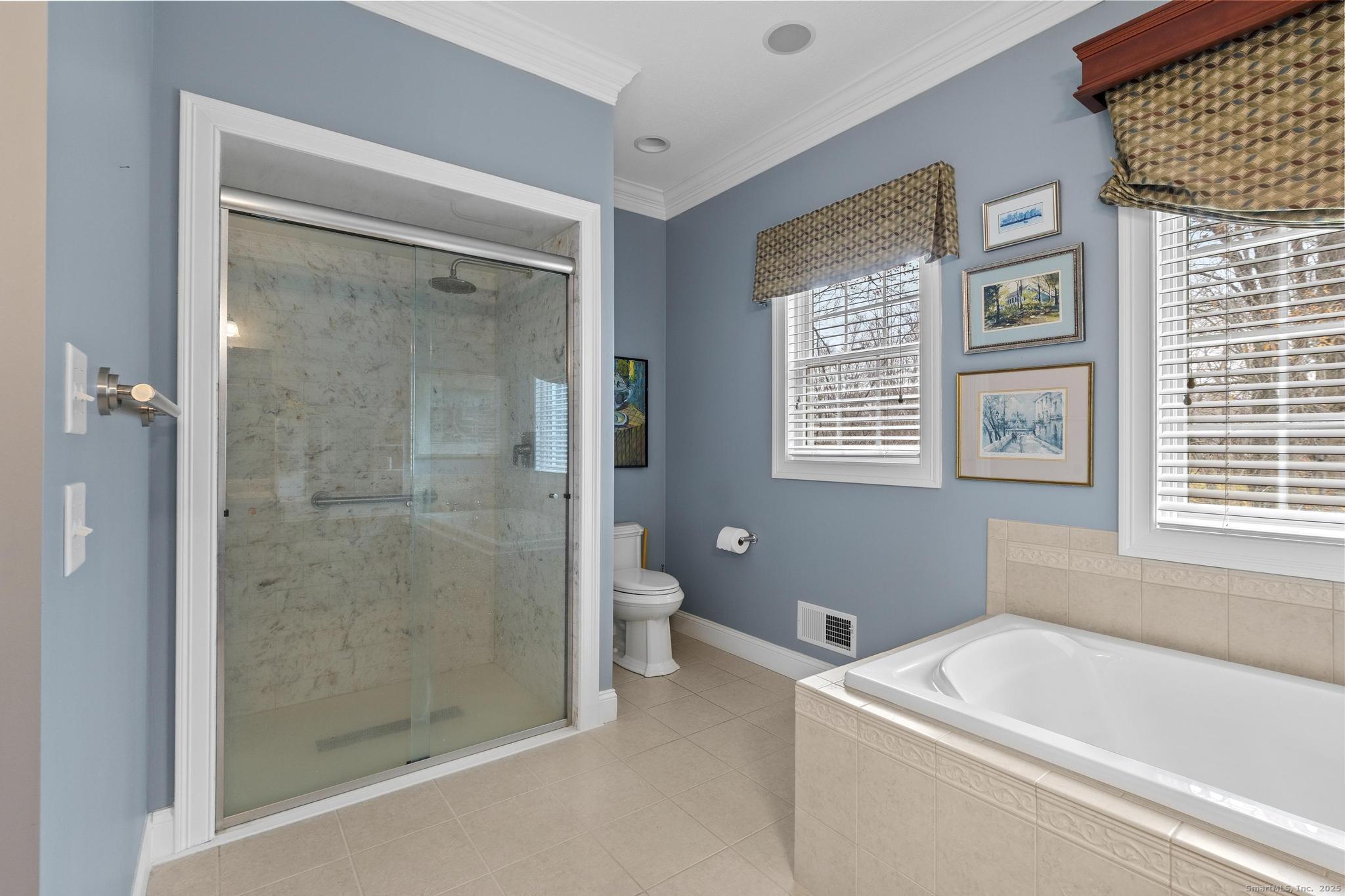 18 Daniel Circle, Unit 18 Suffield, CT 06078 - Photo 25 of 38 a bath room with a bath tub and a shower