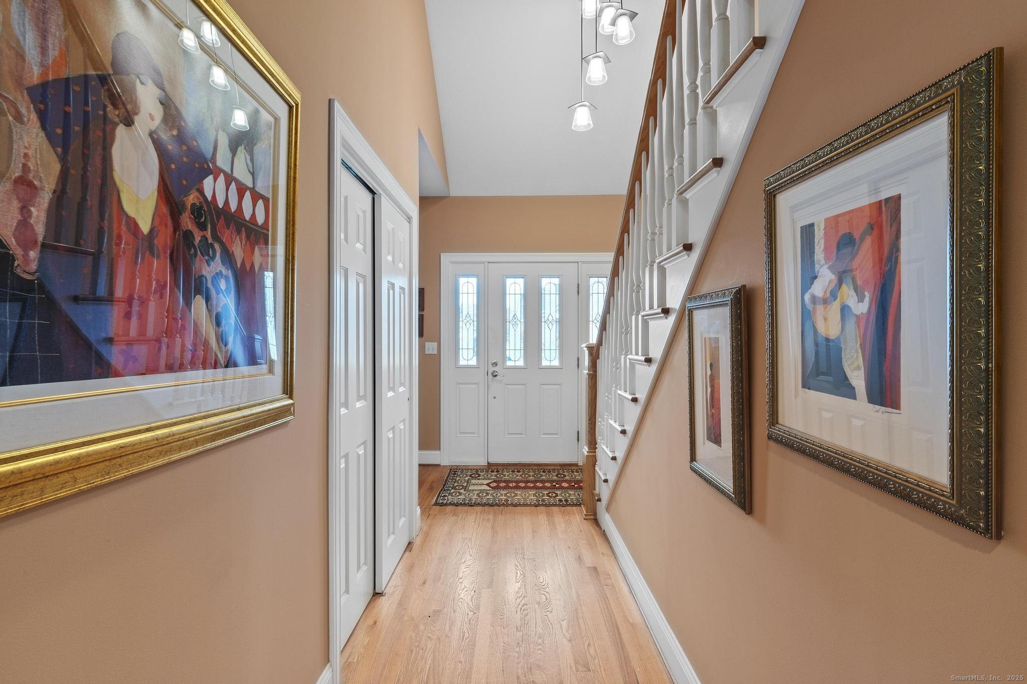 18 Daniel Circle, Unit 18 Suffield, CT 06078 - Photo 4 of 38 a view of an entryway with wooden floor