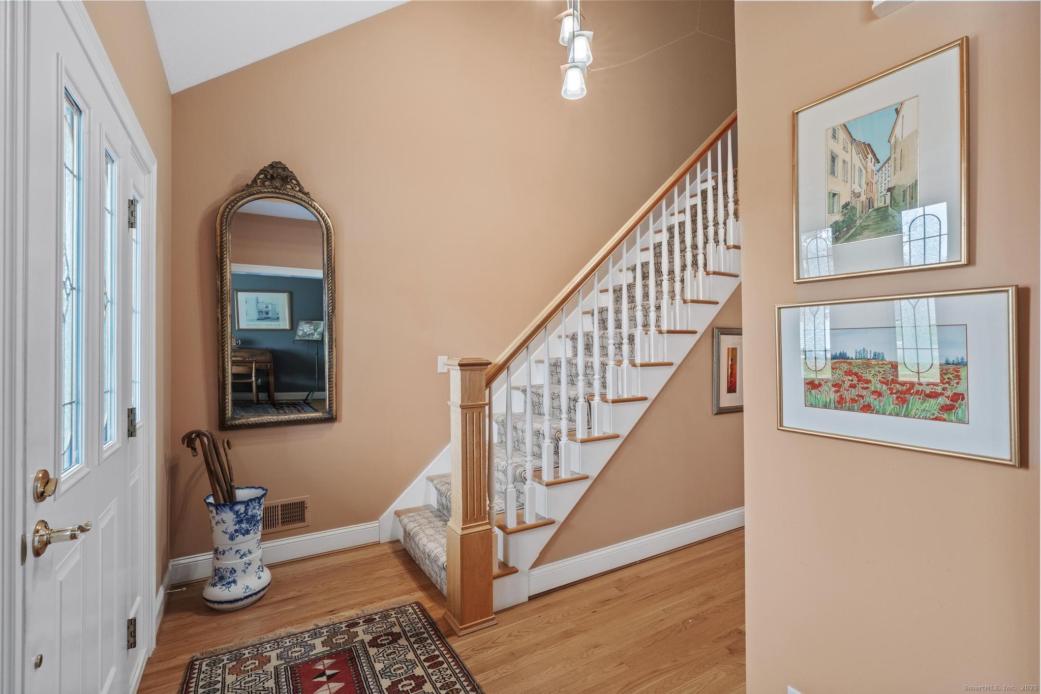 18 Daniel Circle, Unit 18 Suffield, CT 06078 - Photo 5 of 38 a view of an entryway with wooden floor