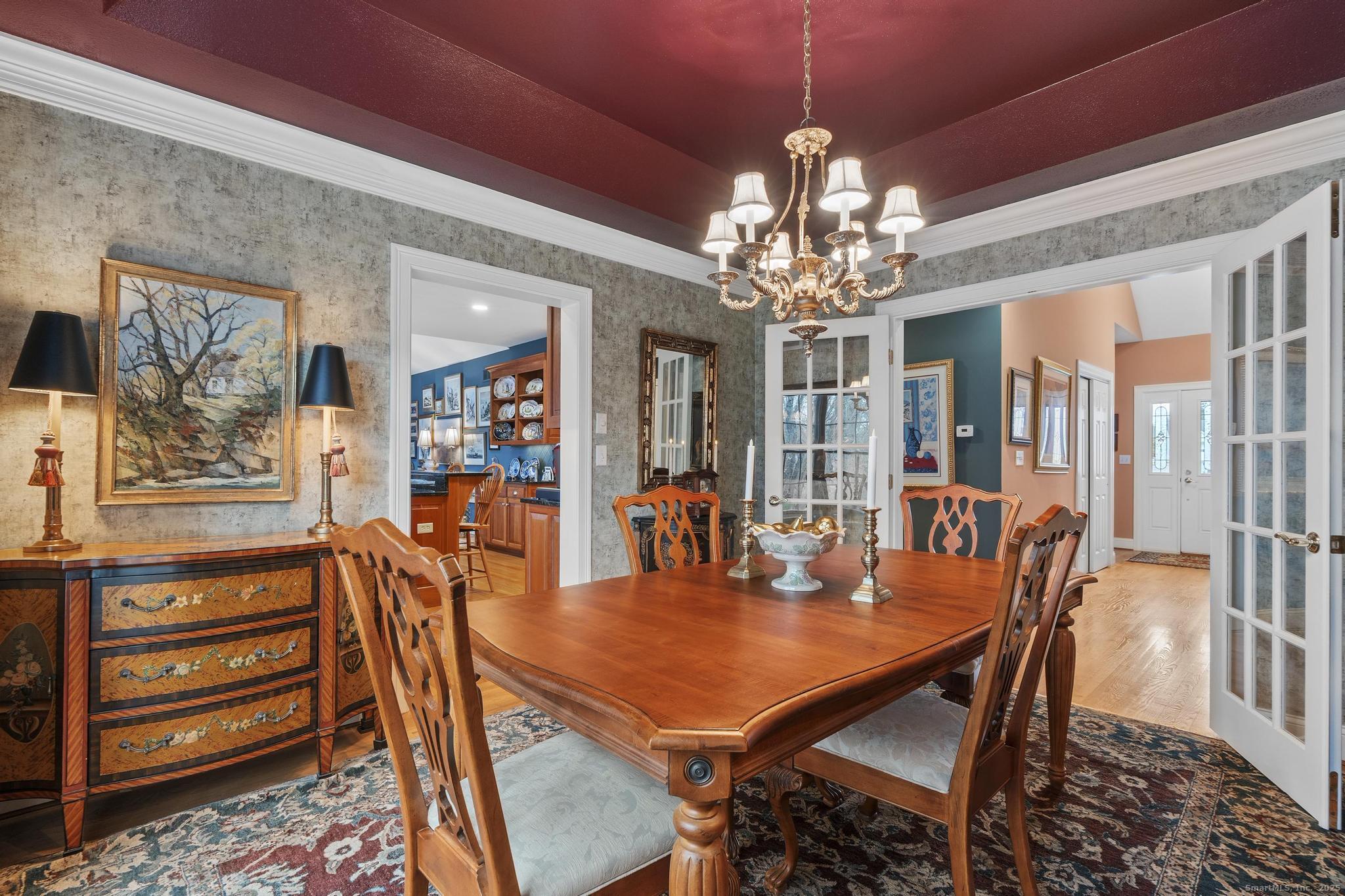 18 Daniel Circle, Unit 18 Suffield, CT 06078 - Photo 8 of 38 a view of a dining room with furniture and chandelier