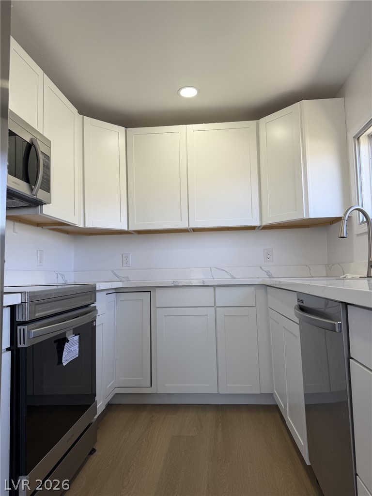 1 Carson Court Ely, NV 89301 - Photo 7 of 20 This bright kitchen features sleek appliances, ample counter space, and modern cabinetry.