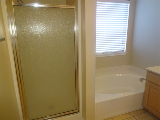 Undisclosed Address Corpus Christi, TX 78413 - Photo 10 of 15 a bathroom with a bathtub and a shower