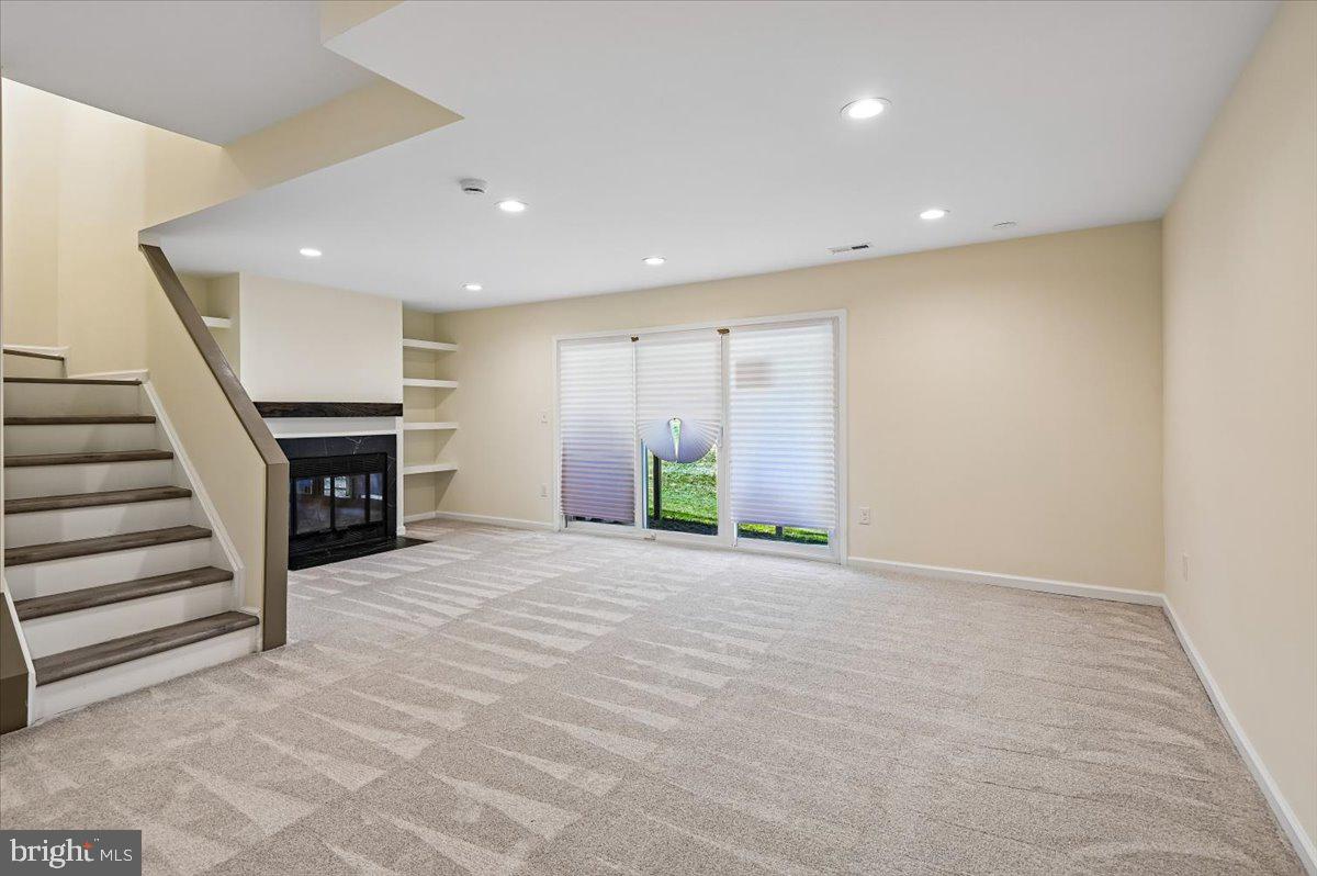 5097 Columbia Road, Unit 16 18 Columbia, MD 21044 - Photo 36 of 65 Rec Room w/ sliding glass door to rear yard