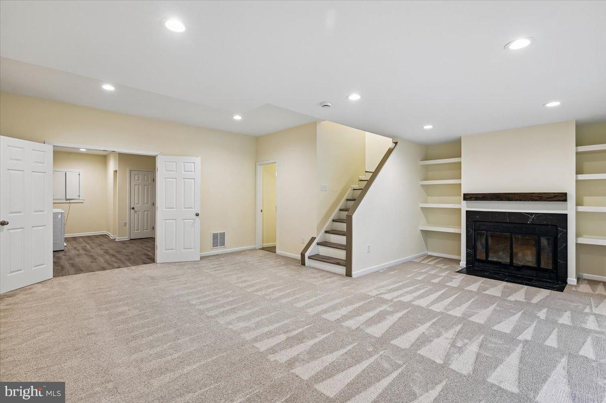 5097 Columbia Road, Unit 16 18 Columbia, MD 21044 - Photo 37 of 65 Rec Room w/ FP & built ins