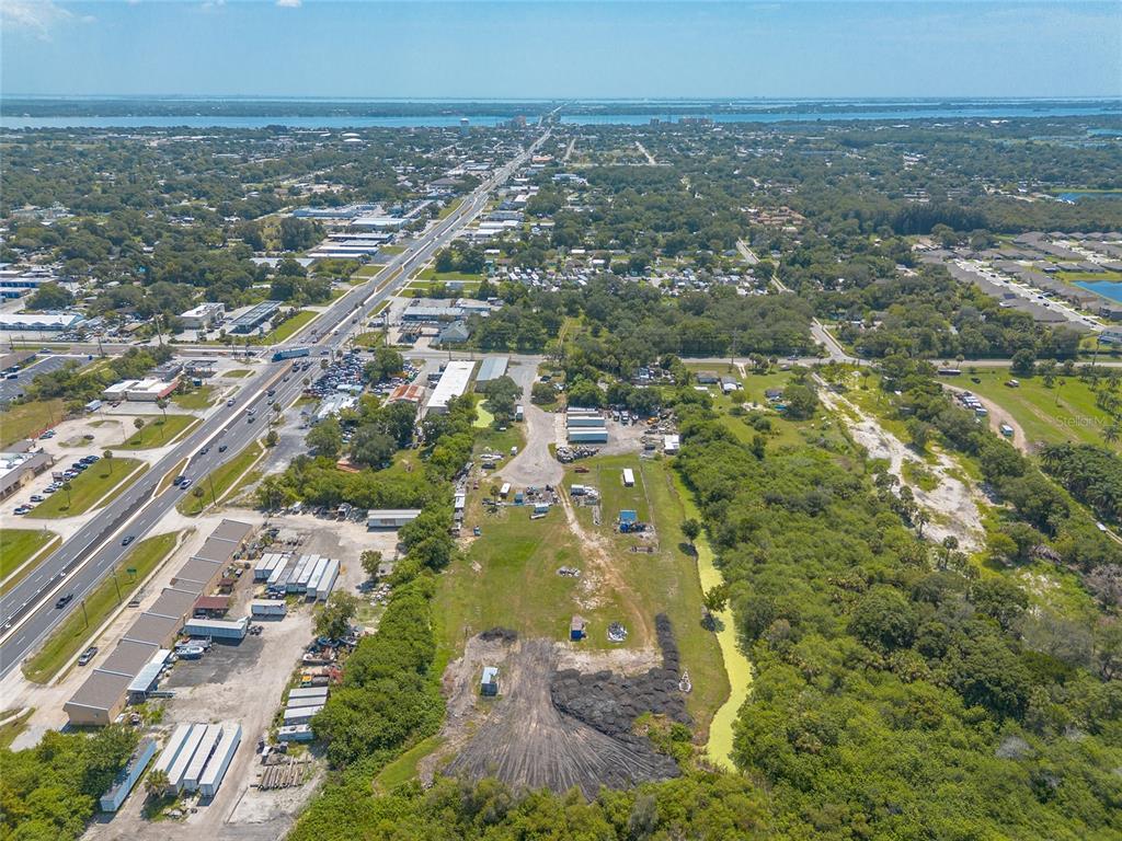 135 Clearlake Road Cocoa, FL 32926 - Photo 18 of 22 an aerial view of residential building and lake