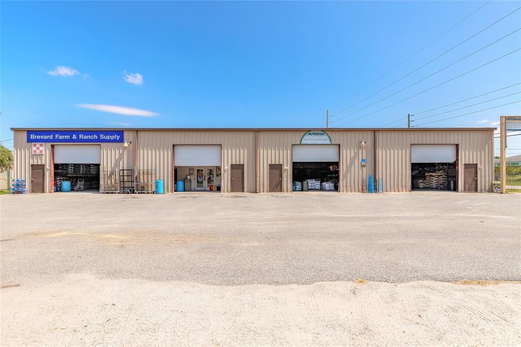 135 Clearlake Road Cocoa, FL 32926 - Photo 2 of 22 a view of large building with a street