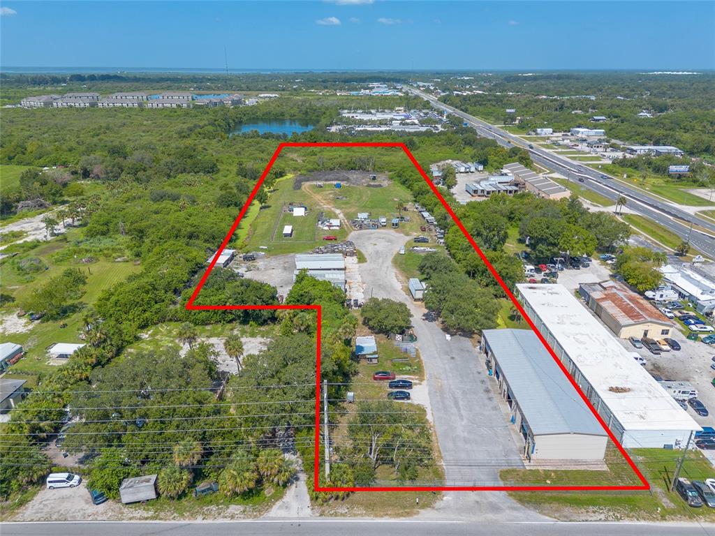 135 Clearlake Road Cocoa, FL 32926 - Photo 3 of 22 an aerial view of residential houses with outdoor space and swimming pool