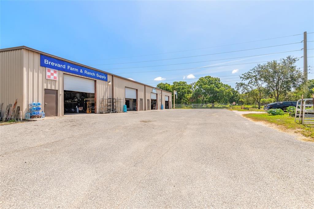 135 Clearlake Road Cocoa, FL 32926 - Photo 6 of 22 a view of outdoor space with deck and tree in front of it
