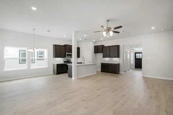 a view of a kitchen with a sink and a kitchen counter top