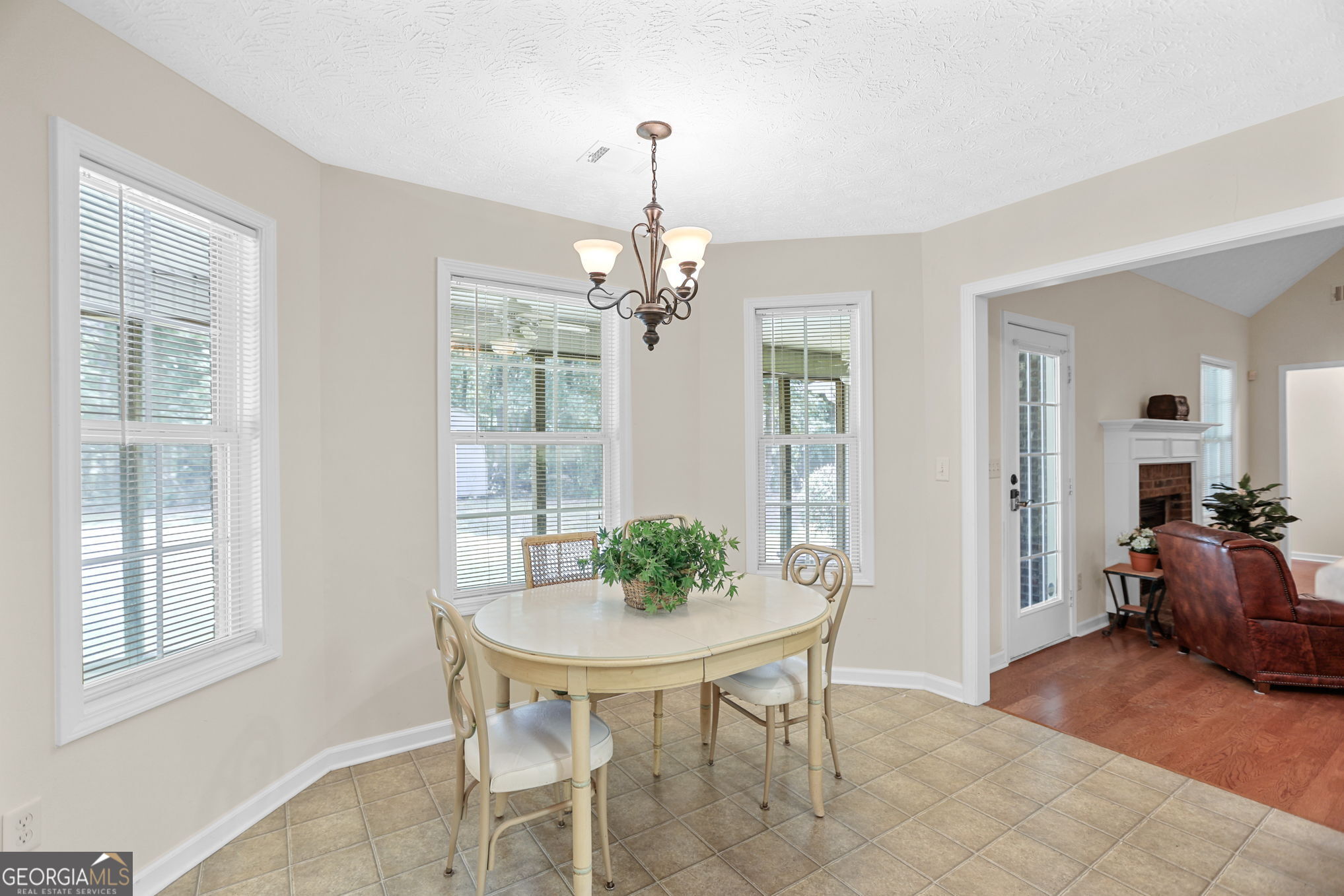 892 Brooks Woolsey Road Brooks, GA 30205 - Photo 8 of 45 a view of a dining room with furniture window and wooden floor