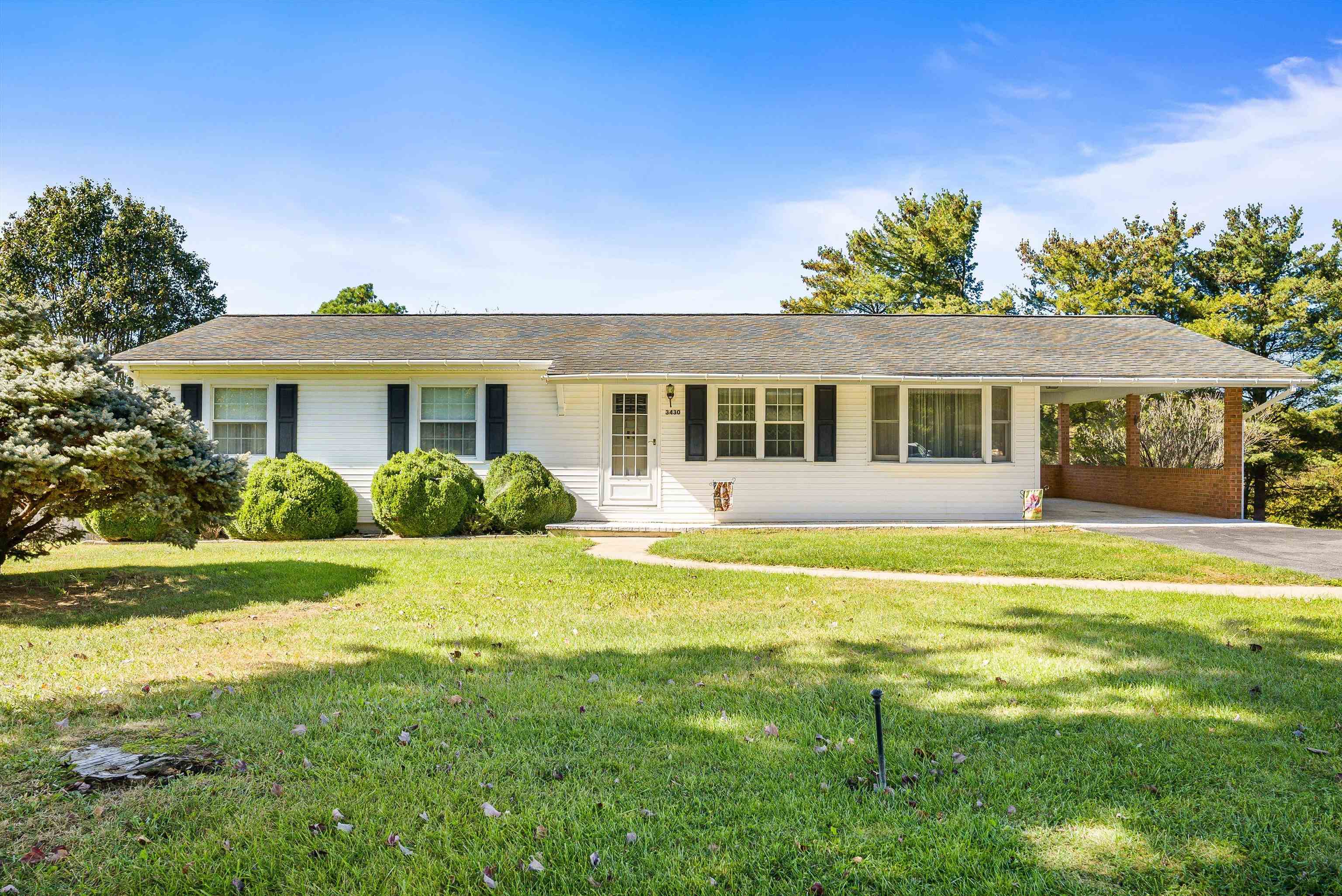 3430 Oak Ridge Road Mount Crawford, VA 22841 - Photo 1 of 59 a front view of a house with a garden