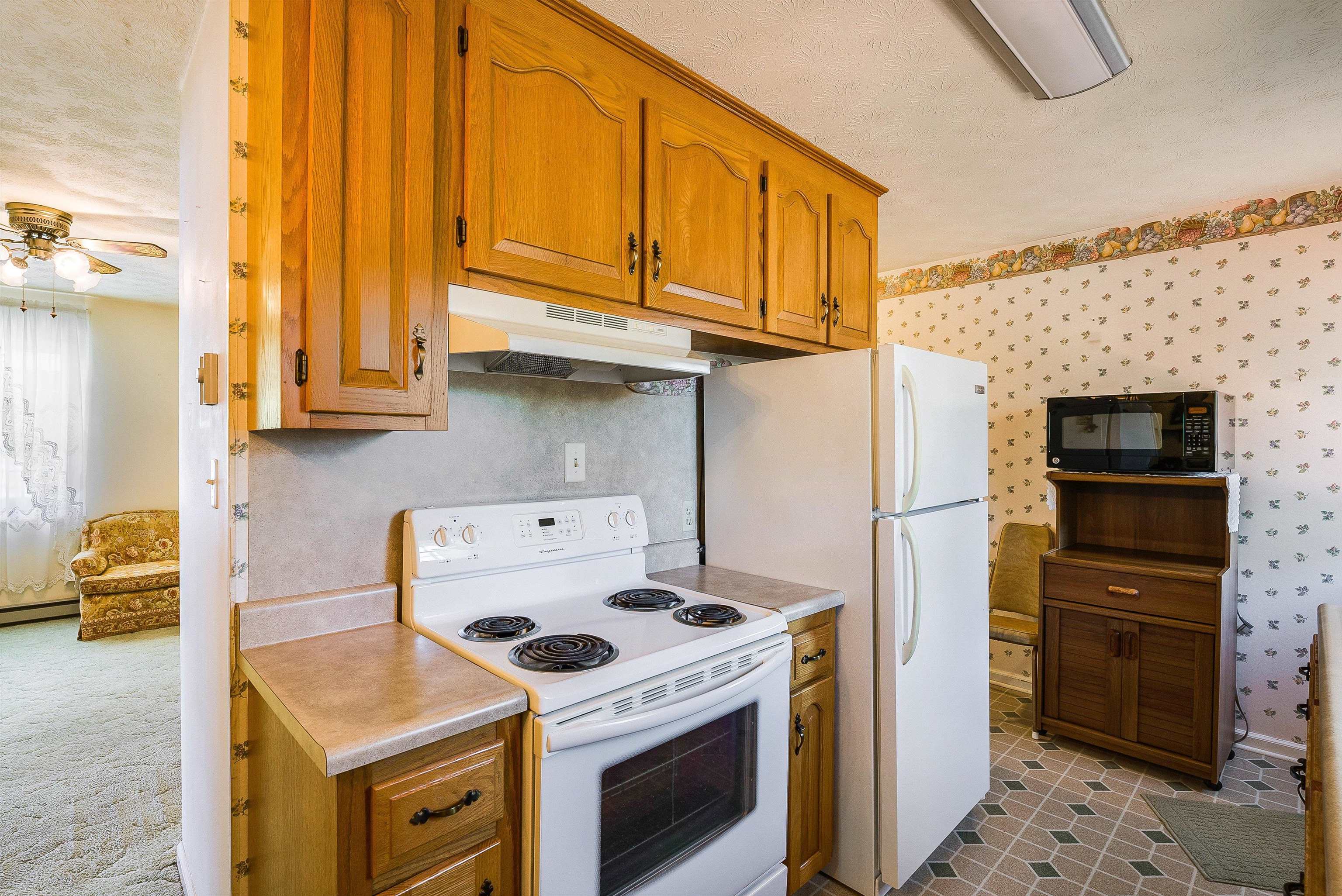 3430 Oak Ridge Road Mount Crawford, VA 22841 - Photo 16 of 59 a kitchen with stainless steel appliances granite countertop a stove and a refrigerator