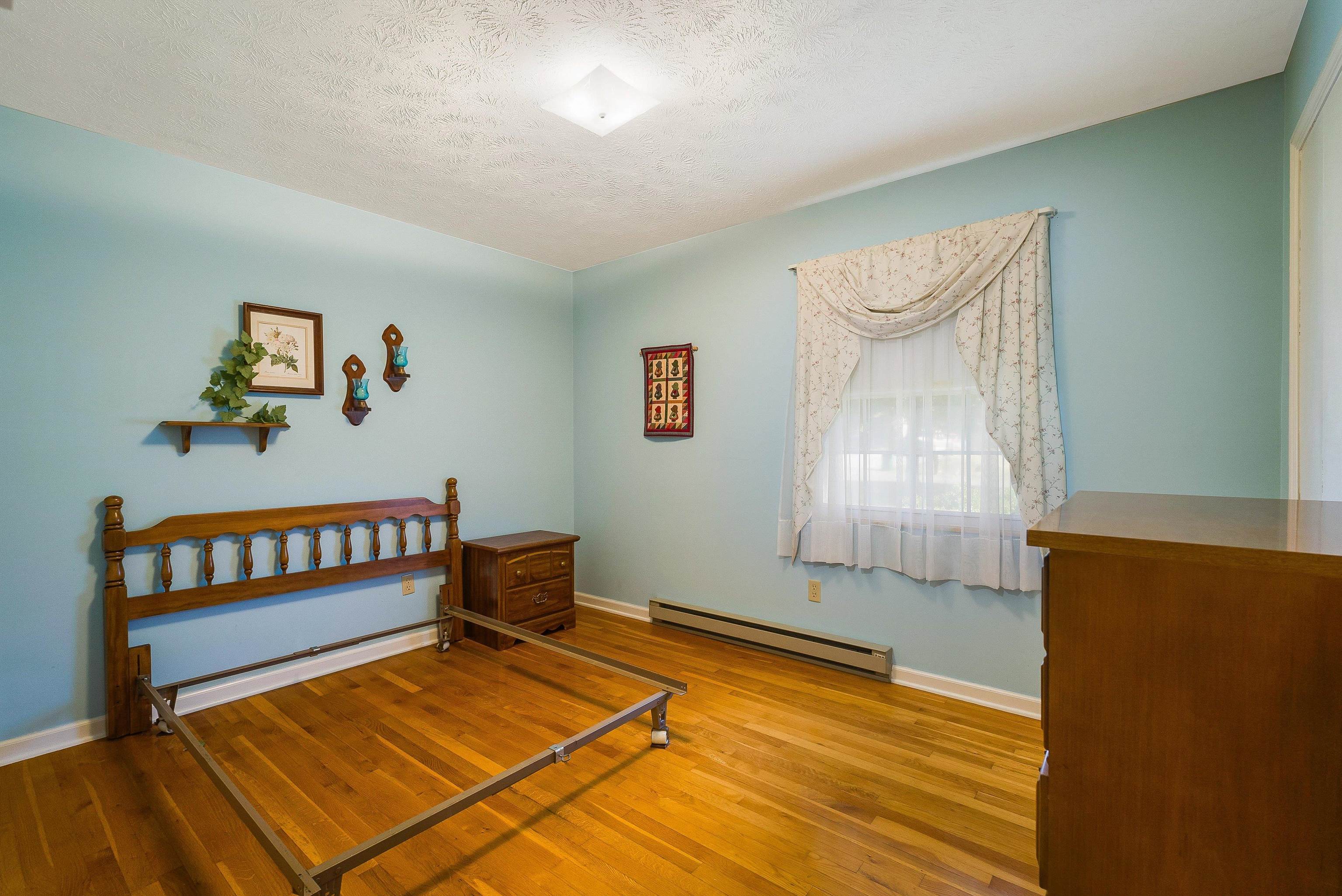 3430 Oak Ridge Road Mount Crawford, VA 22841 - Photo 23 of 59 a view of an empty room with a window and wooden floor