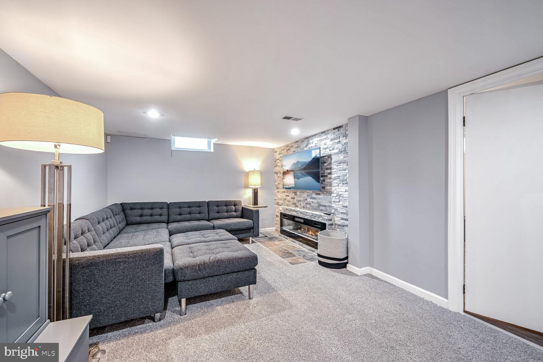 807 Lanark Way Silver Spring, MD 20901 - Photo 16 of 39 a bedroom with furniture and a couch