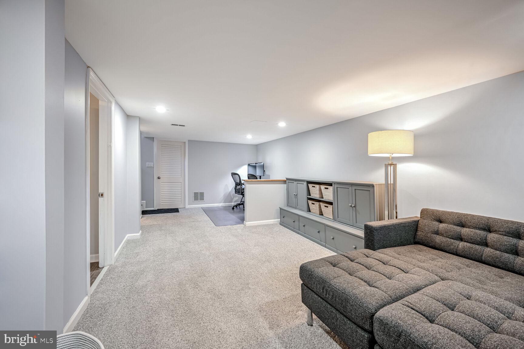 807 Lanark Way Silver Spring, MD 20901 - Photo 17 of 39 a bed room with furniture and a lamp