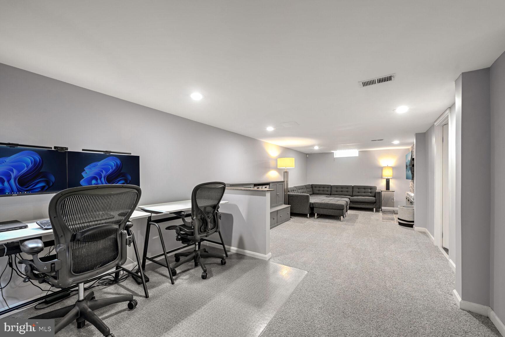 807 Lanark Way Silver Spring, MD 20901 - Photo 18 of 39 a living room with furniture and a table with chairs