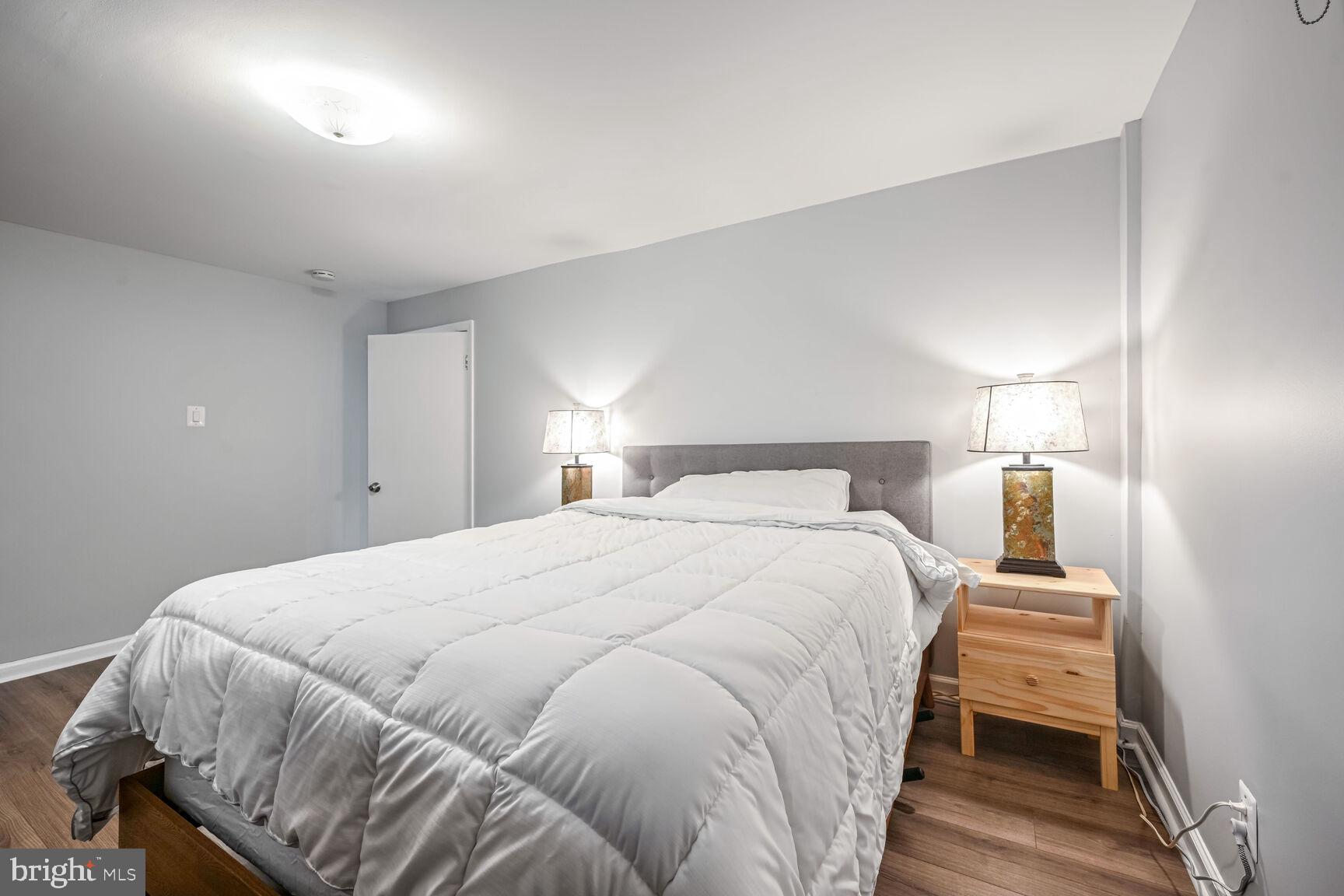 807 Lanark Way Silver Spring, MD 20901 - Photo 19 of 39 a bedroom with a bed and a night stand