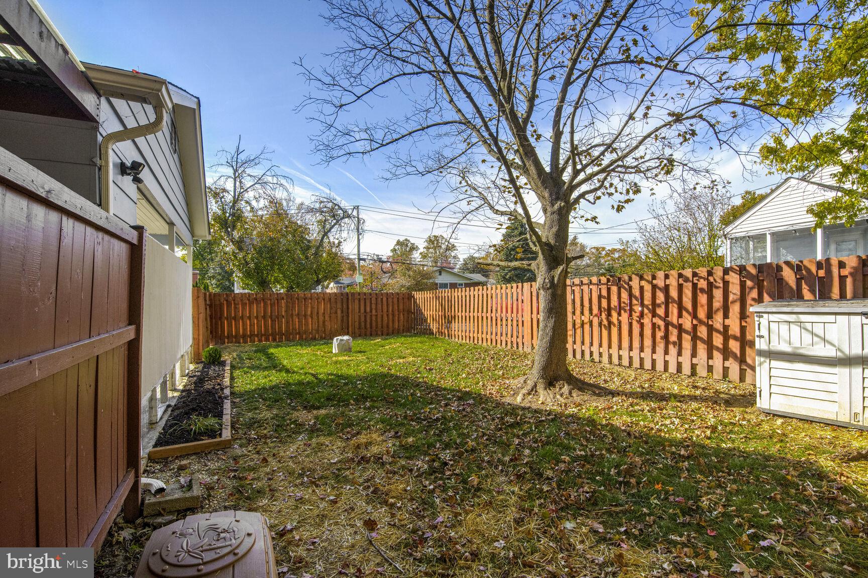 807 Lanark Way Silver Spring, MD 20901 - Photo 26 of 39 a view of a yard with wooden fence