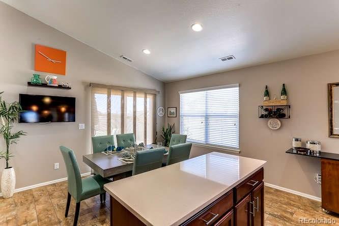 4068 Desert Ridge Circle Castle Rock, CO 80108 - Photo 12 of 25 a view of a dining room with furniture and window