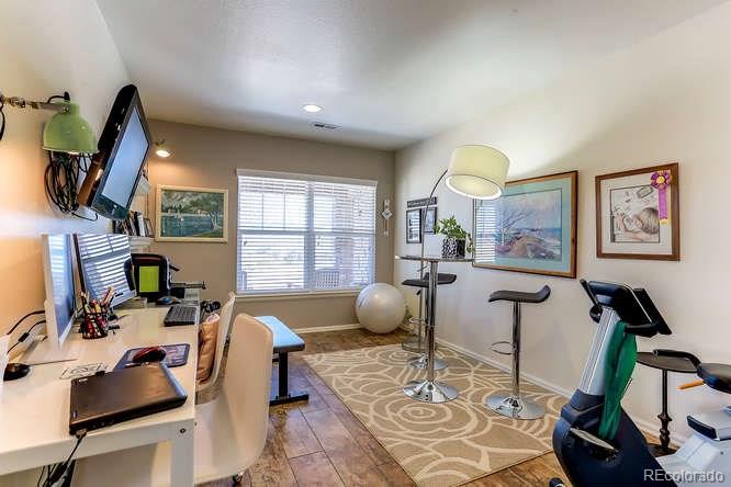 4068 Desert Ridge Circle Castle Rock, CO 80108 - Photo 13 of 25 a room with furniture a window and a flat screen tv