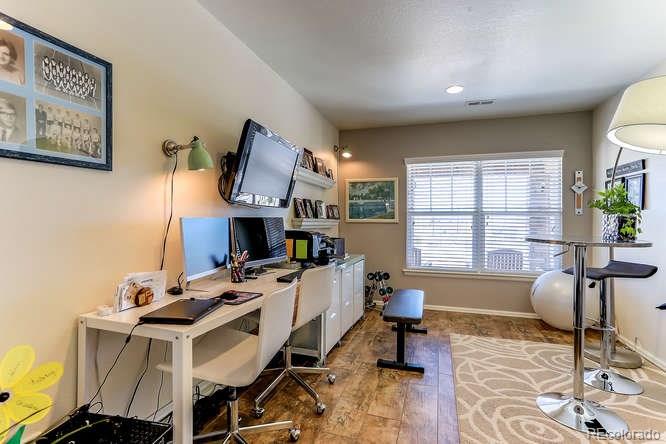 4068 Desert Ridge Circle Castle Rock, CO 80108 - Photo 14 of 25 a living room with furniture a fireplace and large windows