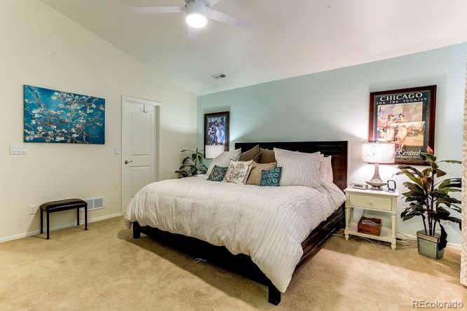 4068 Desert Ridge Circle Castle Rock, CO 80108 - Photo 16 of 25 a bedroom with a bed and a chair