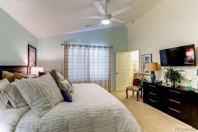 4068 Desert Ridge Circle Castle Rock, CO 80108 - Photo 17 of 25 a bedroom with a bed and a flat screen tv