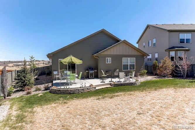 4068 Desert Ridge Circle Castle Rock, CO 80108 - Photo 22 of 25 a front view of a house with swimming pool having outdoor seating