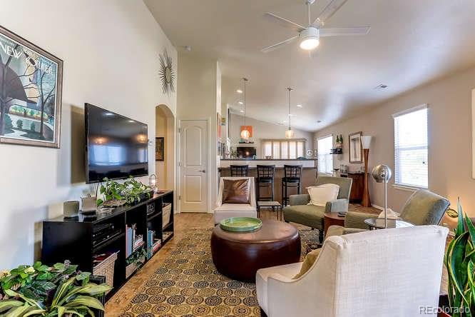 4068 Desert Ridge Circle Castle Rock, CO 80108 - Photo 4 of 25 a living room with furniture and a flat screen tv