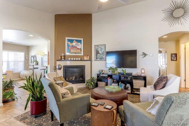 4068 Desert Ridge Circle Castle Rock, CO 80108 - Photo 5 of 25 a living room with furniture and a fireplace