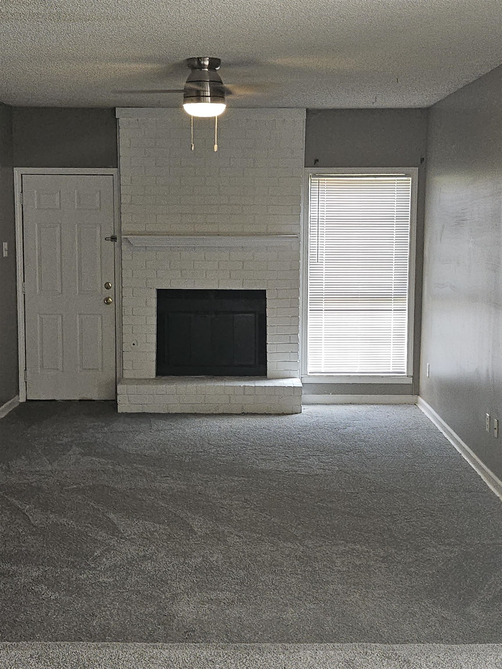6223 Ashton Road, Unit 6223A Memphis, TN 38134 - Photo 13 of 14 a living room with a fireplace