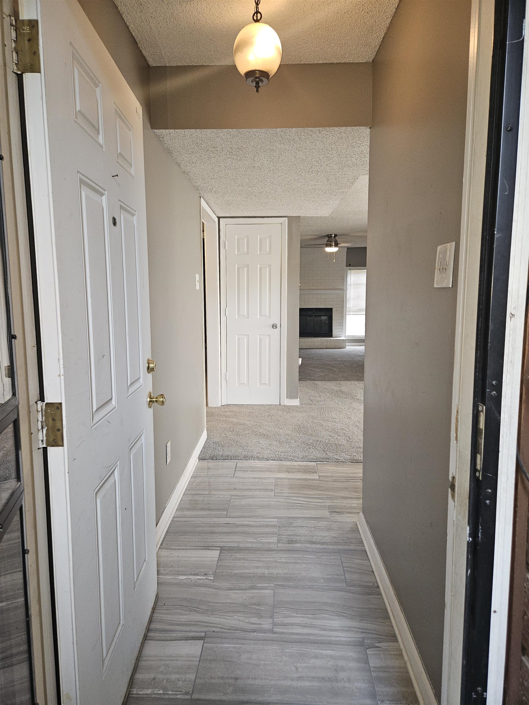 6223 Ashton Road, Unit 6223A Memphis, TN 38134 - Photo 2 of 14 a view of a hallway with wooden floor