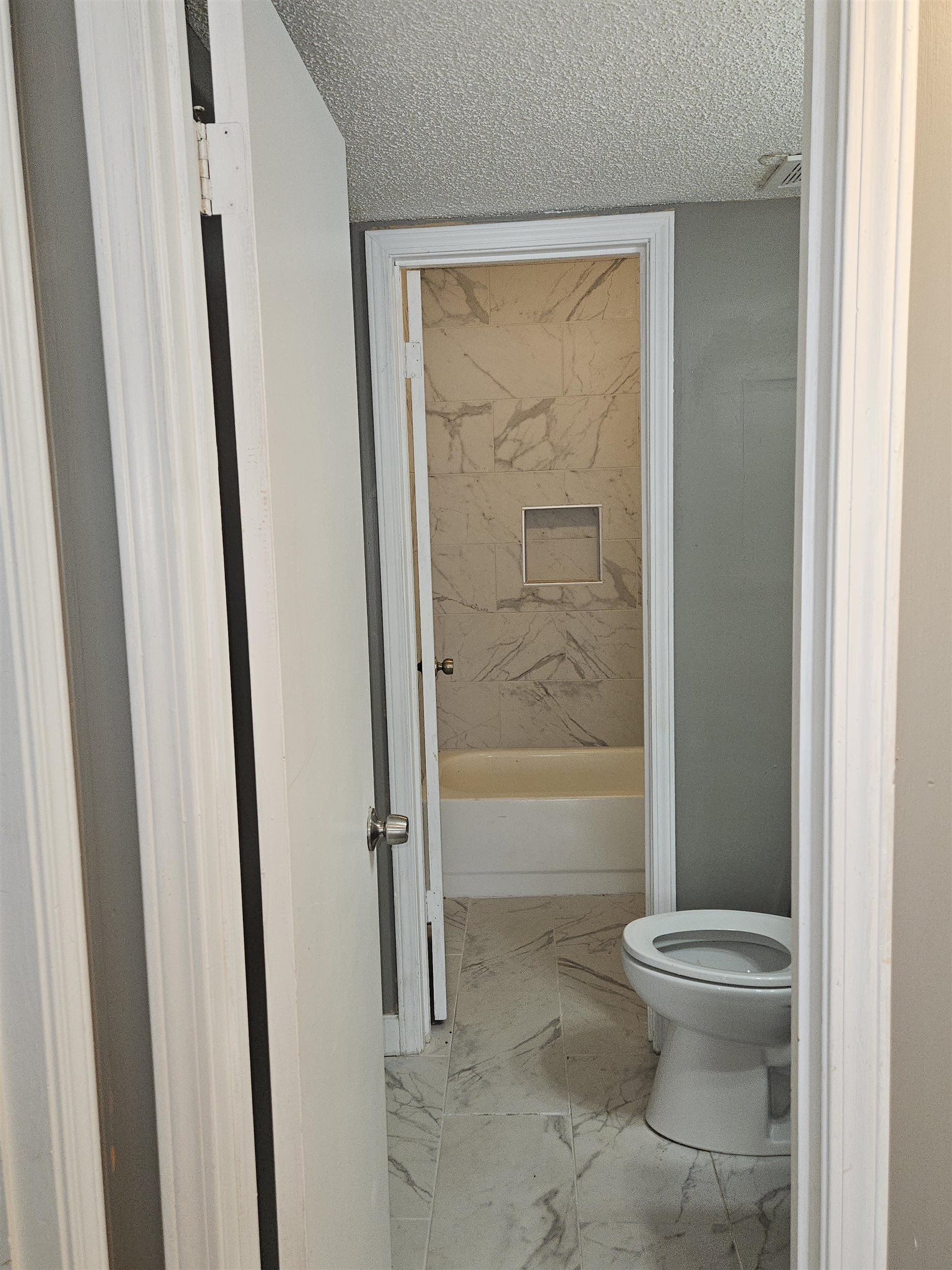 6223 Ashton Road, Unit 6223A Memphis, TN 38134 - Photo 9 of 14 a bathroom with a toilet and a shower