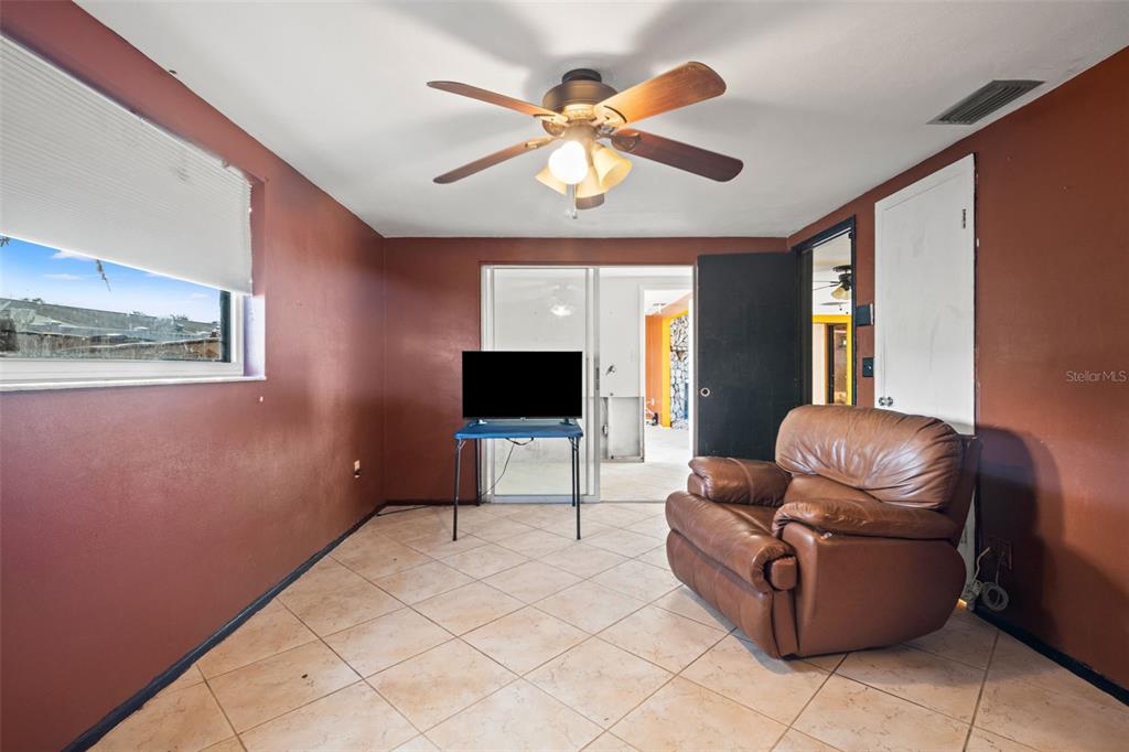 11200 Tamarix Avenue Port Richey, FL 34668 - Photo 14 of 28 a living room with furniture and a flat screen tv