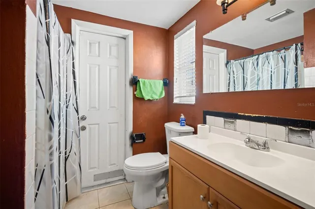 a room with furniture and a potted plant